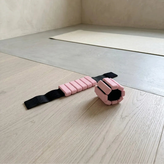 TSC 2lb ankle and wrist weights in rose pink on studio floor - The Sculpt Club East Lothian