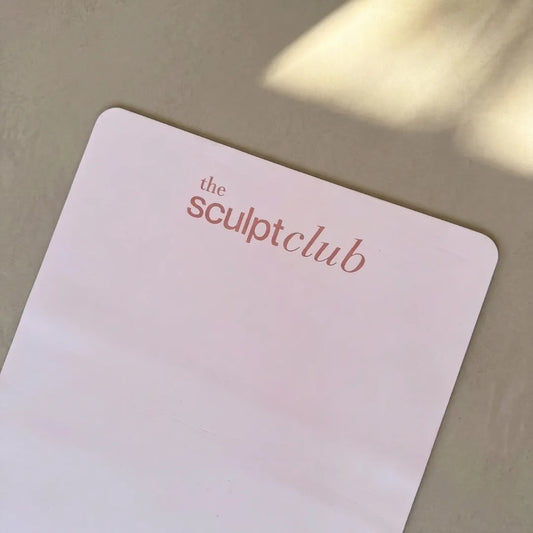 Laser engraved The Sculpt Club logo on TSC rose pink pilates mat